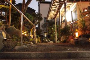 a house at night with the lights on w obiekcie Rental villa Saya - Vacation STAY 85439v w mieście Chigasaki