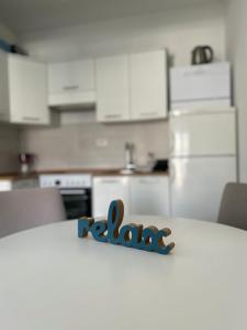 a table with the word raale on it in a kitchen at Vanilla Studio in Bar