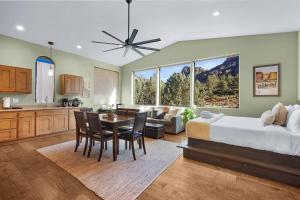 a large bedroom with a bed and a table and chairs at Mammoth Rock Retreat Villa-Sleeps 4 in Sedona