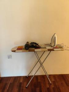 a table with a laptop computer on top of it at Little Orange Homestay in Bintulu