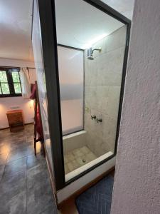 a bathroom with a shower with a glass door at Aljabas in San Martín de los Andes