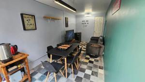 a dining room with a table and chairs in a room at Casa Columpio in Mexico City