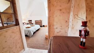 Postel nebo postele na pokoji v ubytování COSY CHAMBRE-SUITE climatisée