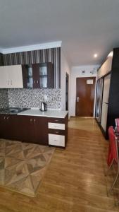 a kitchen with a sink and a counter top at Orbi Residence Volna,Batumi apart in Batumi