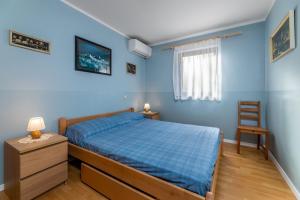 Ein Bett oder Betten in einem Zimmer der Unterkunft Marina
