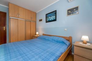 Ein Bett oder Betten in einem Zimmer der Unterkunft Marina