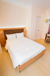 Postel nebo postele na pokoji v ubytování JVJ Hotel