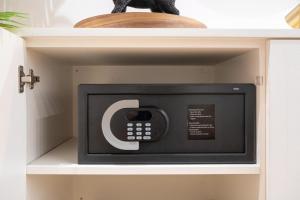 a microwave inside of a cabinet in a kitchen at Quartier Notre Dame in Paris