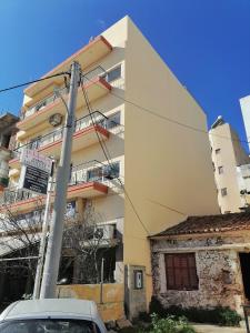 a car parked in front of a building at Anastasia's Apartment ΛΑΥΡΙΟ in Lávrion