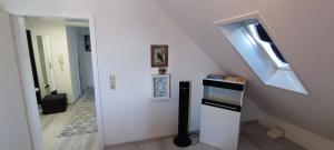 a white kitchen with a stove and a window at Antony Home Ferienwohnung in Ostrach