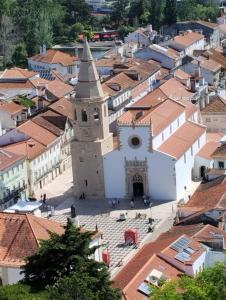 an aerial view of a town with a church at Hotel República Boutique Hotel in Tomar