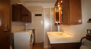 a bathroom with a sink and a shower at Appartamento due Pini Lago di Garda in Salò +22 photos