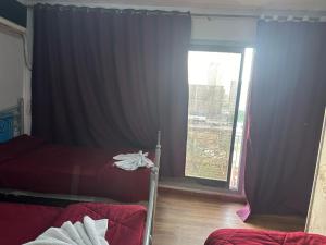 Letto o letti in una camera di Al Waha Hostel