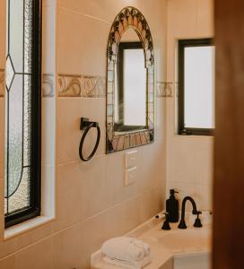 a bathroom with a sink and a mirror at Misty Mountain Manor in Uki +22 photos