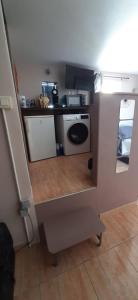 a small kitchen with a sink and a stove at Chambre spacieuse, indépendante, 5mn de la gare in Narbonne