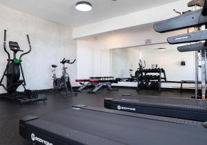 a gym with treadmills and exercise bikes in it at Torre Opus 31 - Apto.605 in Santo Domingo
