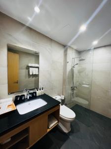 a bathroom with a sink and a toilet and a shower at Bibi’s home in Danang +37 photos