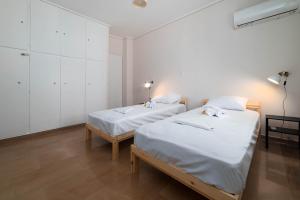 Postel nebo postele na pokoji v ubytování Spacious Nest 2bd apartment next to Acropolis