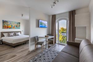 Posteľ alebo postele v izbe v ubytovaní Hotel Giardinetto