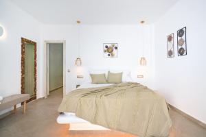 Postel nebo postele na pokoji v ubytování Electra Suites & Spa