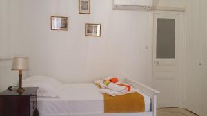 Postel nebo postele na pokoji v ubytování Bel Appartement Typique proche du Palais et Plages