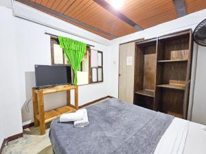 A bed or beds in a room at La Mercedes Lite Hostal By MH