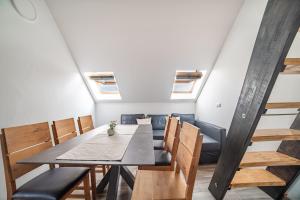 a dining room with a table and chairs at Eagle view Apartment Tisno in Tisno