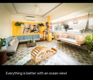 a living room with a bicycle painting on the wall at Top-floor Oceanfront Designer Condo In Bandra in Mumbai