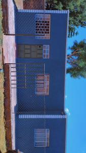 an overhead view of a blue building with windows at Mella homes limuru in Limuru