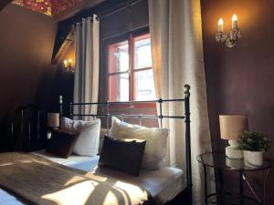 a bedroom with a bed and a window at 2-Floor Traditional Prague Apartment in Prague