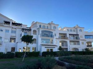 a large white building with a tree in front of it at Casa-Zeelandia Haciënda Riquelme Sucina Murcia in Sucina