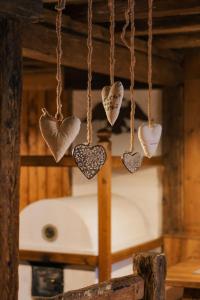 a group of hearts hanging on a chain at Oberwirtshof in Rifiano