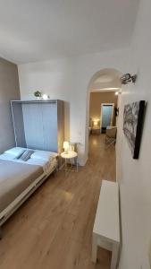 a bedroom with a bed and a table in a room at Petit Bijou de Rome Vatican-Trastevere in Rome