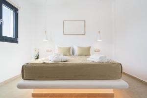 Postel nebo postele na pokoji v ubytování Electra Suites & Spa