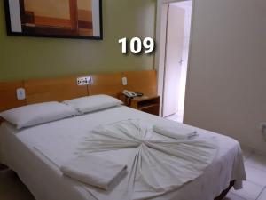 En eller flere senge i et værelse på HOTEL PRINCIPE