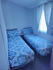 a small room with a bed and a window at Ultimate serene getaway in East Mersea +46 photos