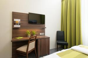 TV a/nebo společenská místnost v ubytování Trip Inn Goethe Conference Hotel
