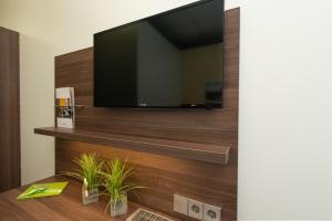 TV a/nebo společenská místnost v ubytování Trip Inn Goethe Conference Hotel