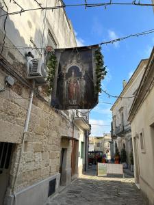 a painting on the side of a building on a street at Dimora Santa Domenica in Scorrano +32 photos