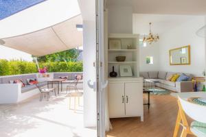 a living room with a couch and a table at CASA LUZ. Casas Los Elementos. in Zahora