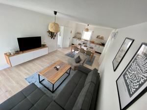 a living room with a couch and a table at Vestovis Holiday House in Mostar