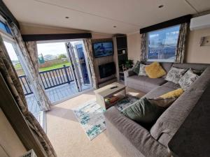 an aerial view of a living room with a couch at Thrillseeker - next to Fantasy Island, Ingoldmells in Skegness