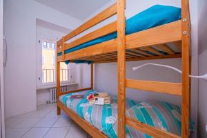 Ένα ή περισσότερα κρεβάτια σε δωμάτιο στο Dogana Best Lake View - Happy Rentals