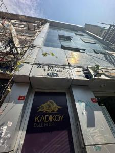 a building with a sign on the side of it at Kadıköy Bull Hotel in Istanbul