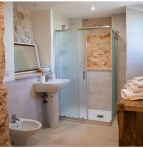 a bathroom with a sink and a shower at Trullo Masiello in Putignano