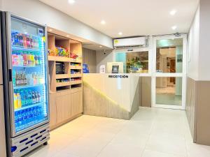a store with a large refrigerator in a store at Stanza Hotel Monteria in Montería