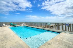 a swimming pool with a view of the ocean at Laguna Village Paradise 2 Home Buyout On Water in Padre Island
