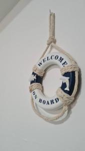 a rope with the words welcome to a boat at Znc Holiday House in Cetara