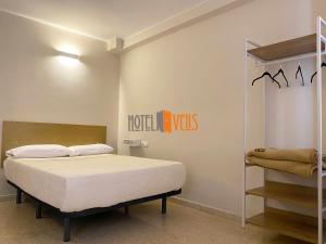Postel nebo postele na pokoji v ubytování Hotel Velis