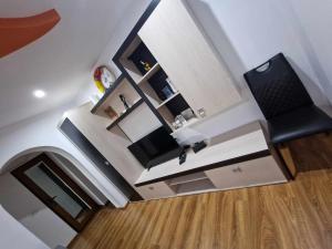an overhead view of a room with a chair and a desk at Apartamentul lui Vlad in Jurilovca